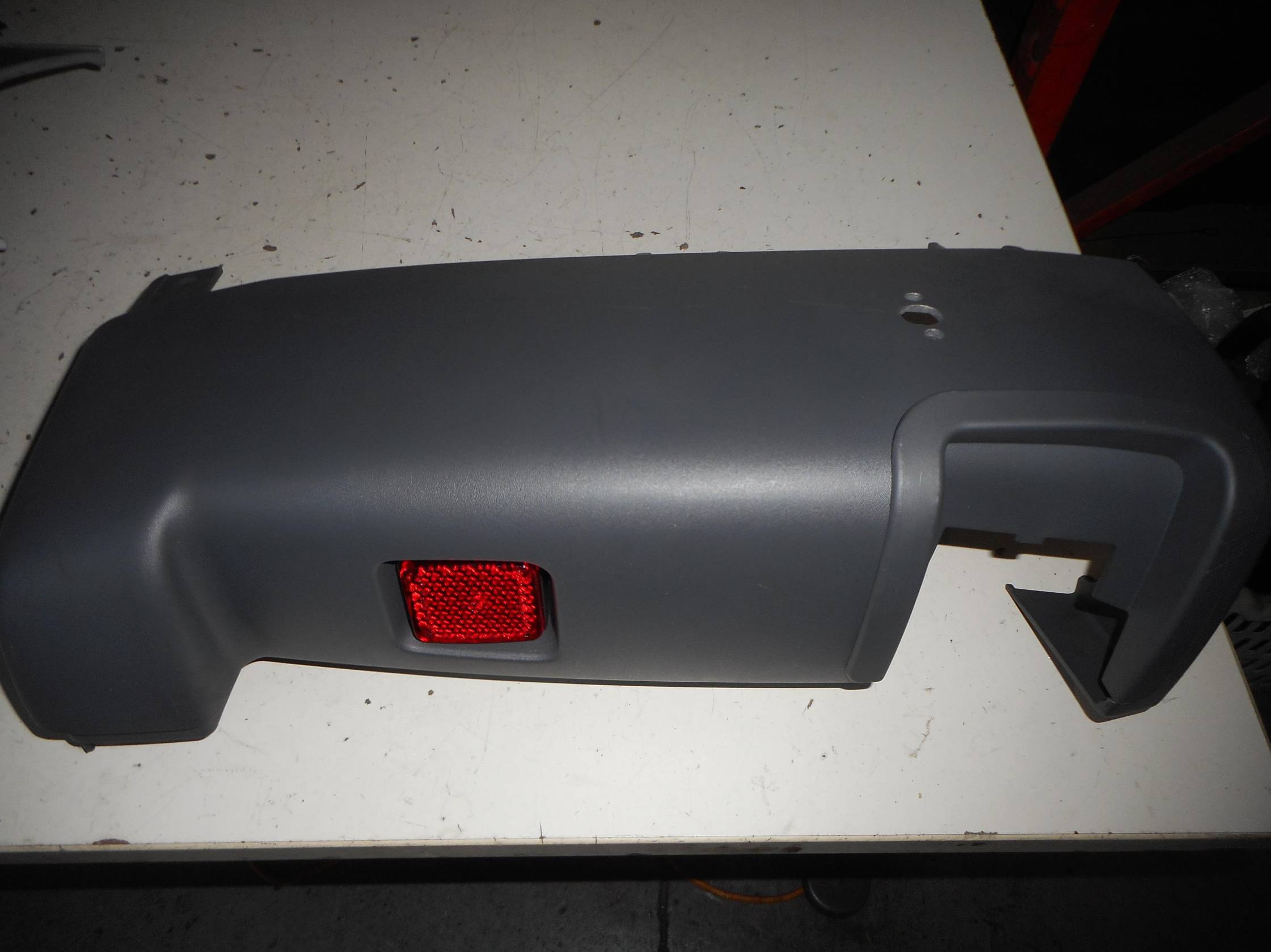 Paraurti post. lat. sx.